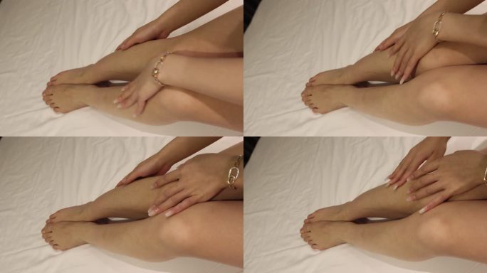 人像身体：美女用手指抚摸自己的小腿