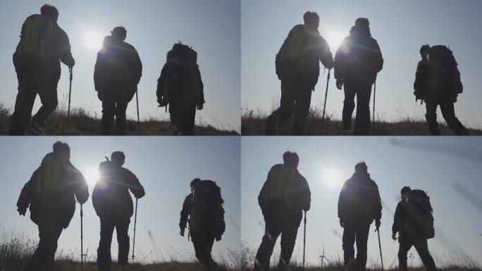 团队登山剪影徒步旅行背包客爬山背影旅行者