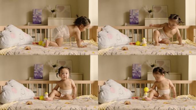 可爱宝宝坐在婴儿床上练习爬行 高帧素材