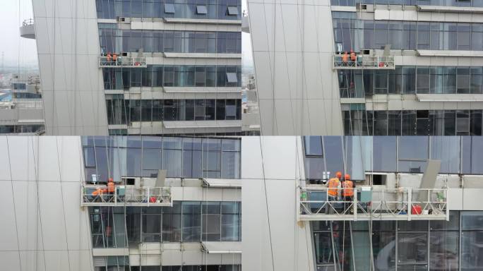 大厦幕墙安装施工高空作业吊篮建筑工人