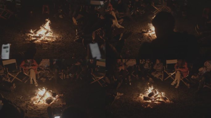 呼伦贝尔大草原夜晚众人围坐烤篝火烤火