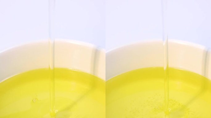 油竖屏升格黄色金色液体润滑油橄榄油慢动作