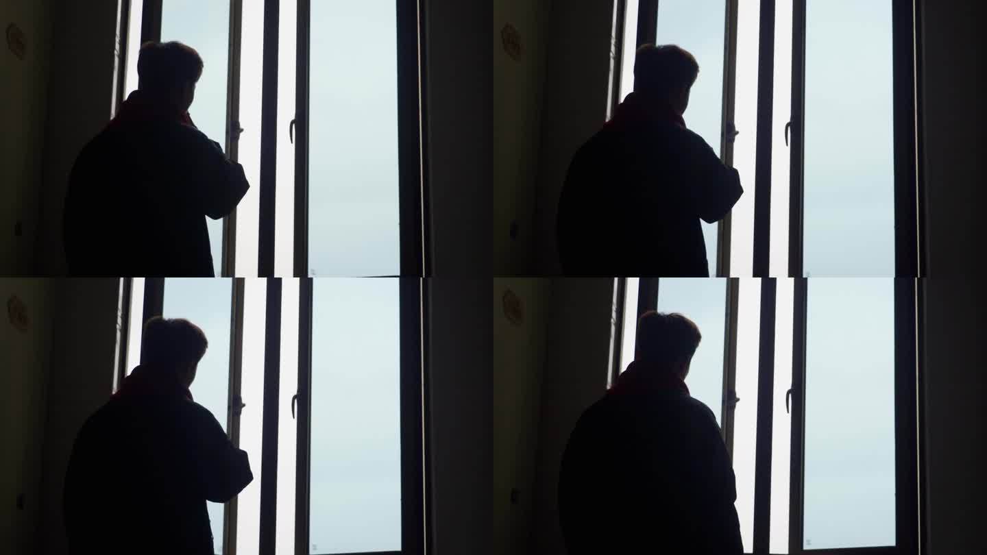 孤独身影男人窗边抽烟背影吸烟剪影工作压力