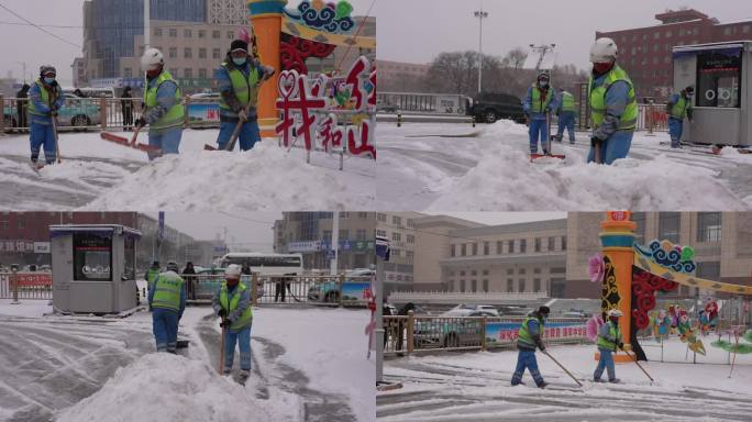 环卫工人雪天清理广场上的积雪