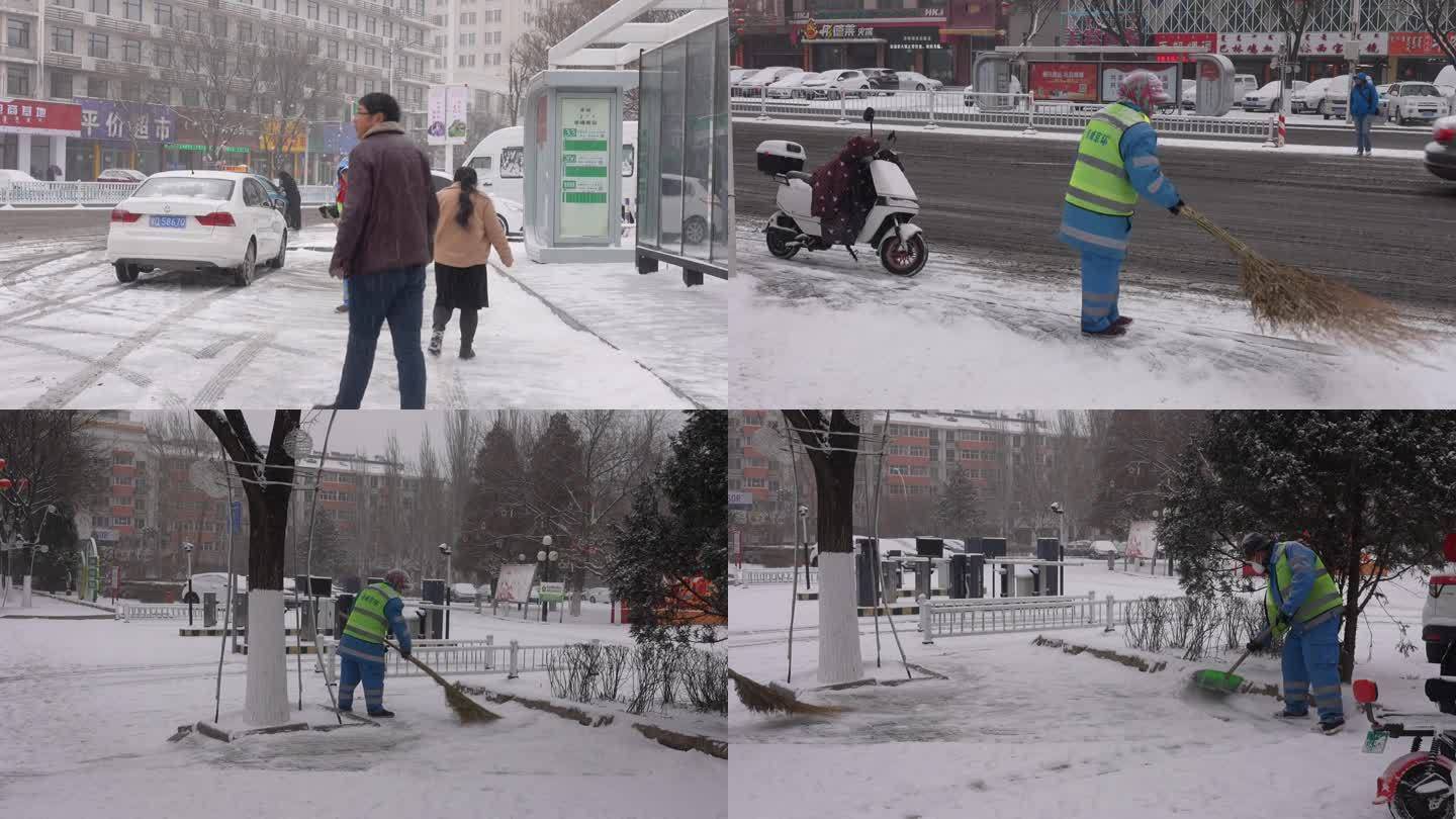 下雪天环卫工人冒雪清理路边积雪