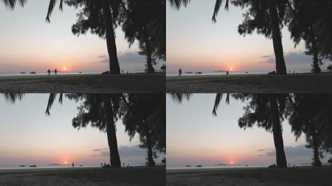 夕阳下的滩涂渔船海岸落日