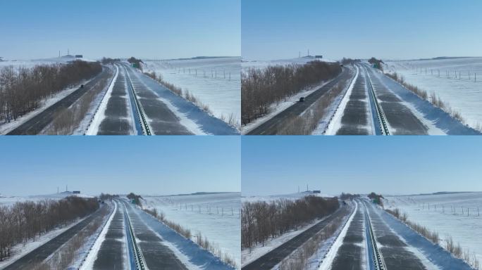 草原公路行驶的汽车风吹雪白毛风