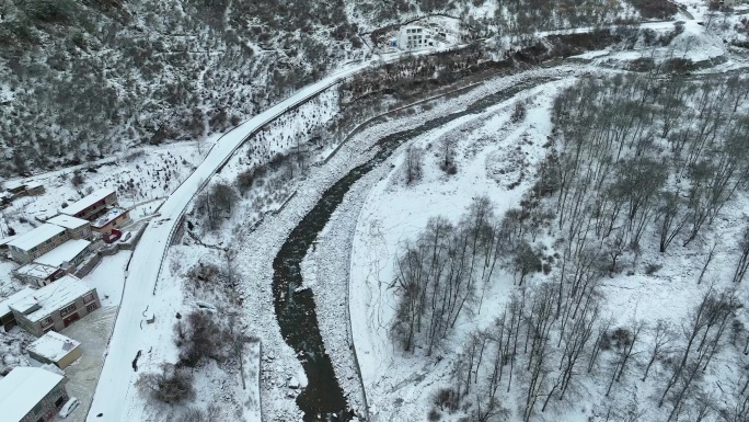 航拍四姑娘山双桥沟雪后村庄山谷