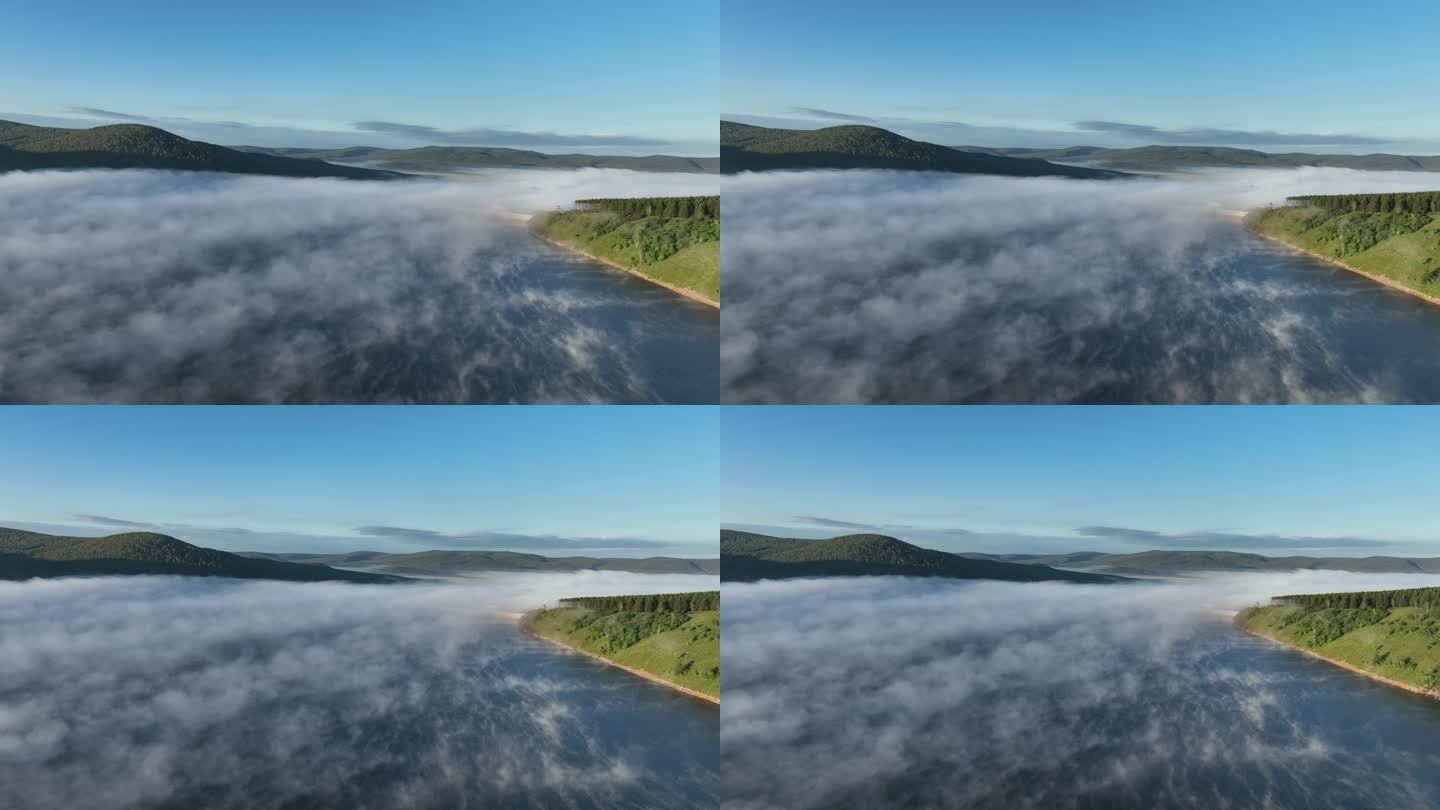 航拍晨雾缭绕的高原湖泊