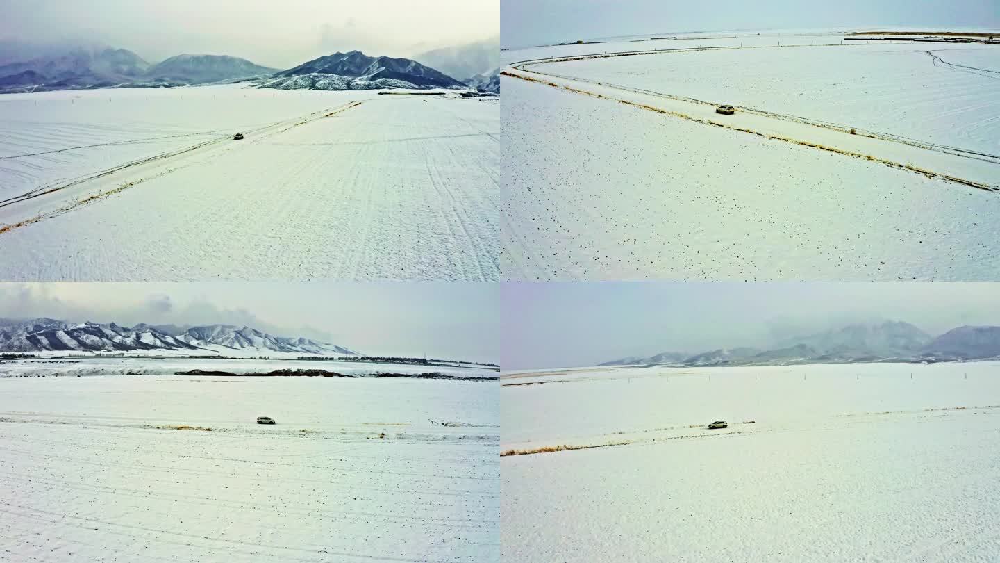 4k航拍汽车行驶在雪的世界里