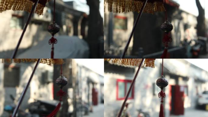 老北京传统脚蹬三轮车上的挂件随风飘扬