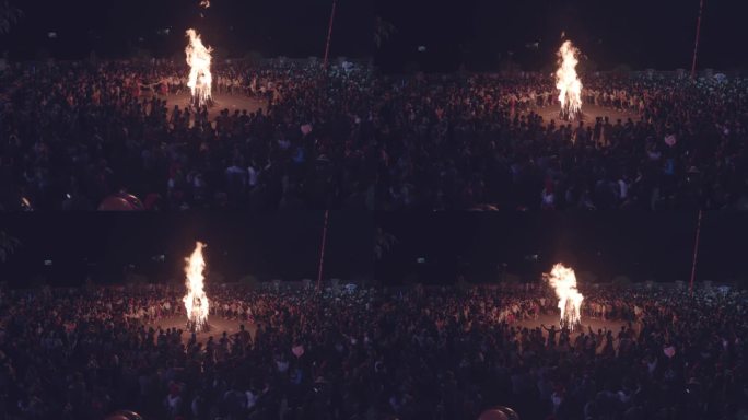 多人围着篝火舞蹈