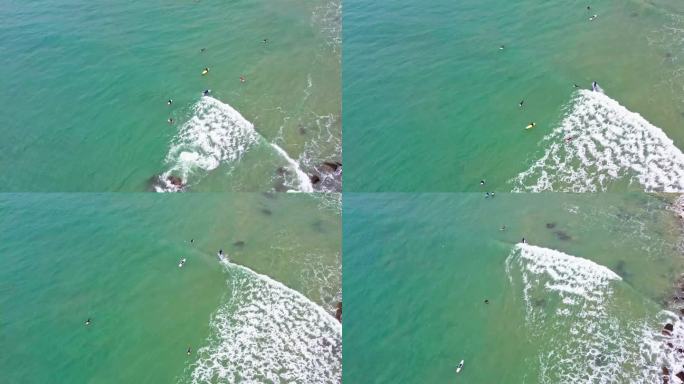 4k冲浪者在海面上冲浪俯拍