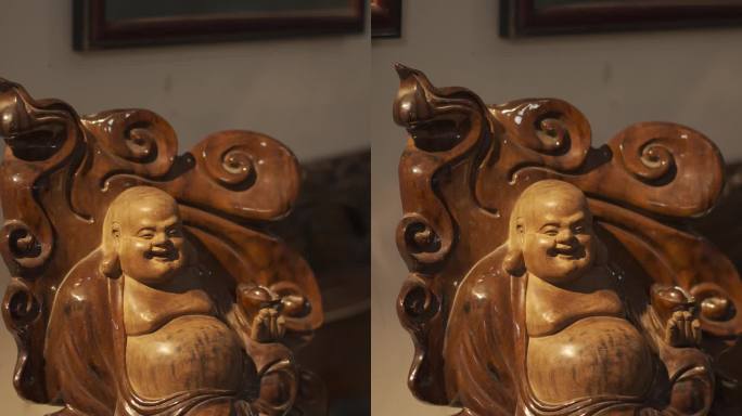 竖屏木雕根雕工艺品展示暖光下的弥勒佛
