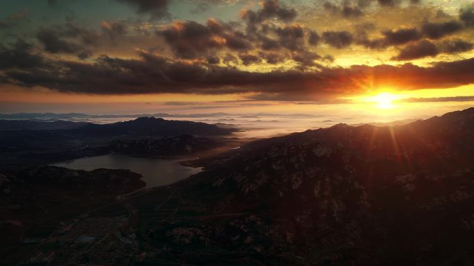 航拍山区海边日出