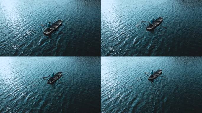 湖面划船一叶孤舟积极前进孤独身影意境概念
