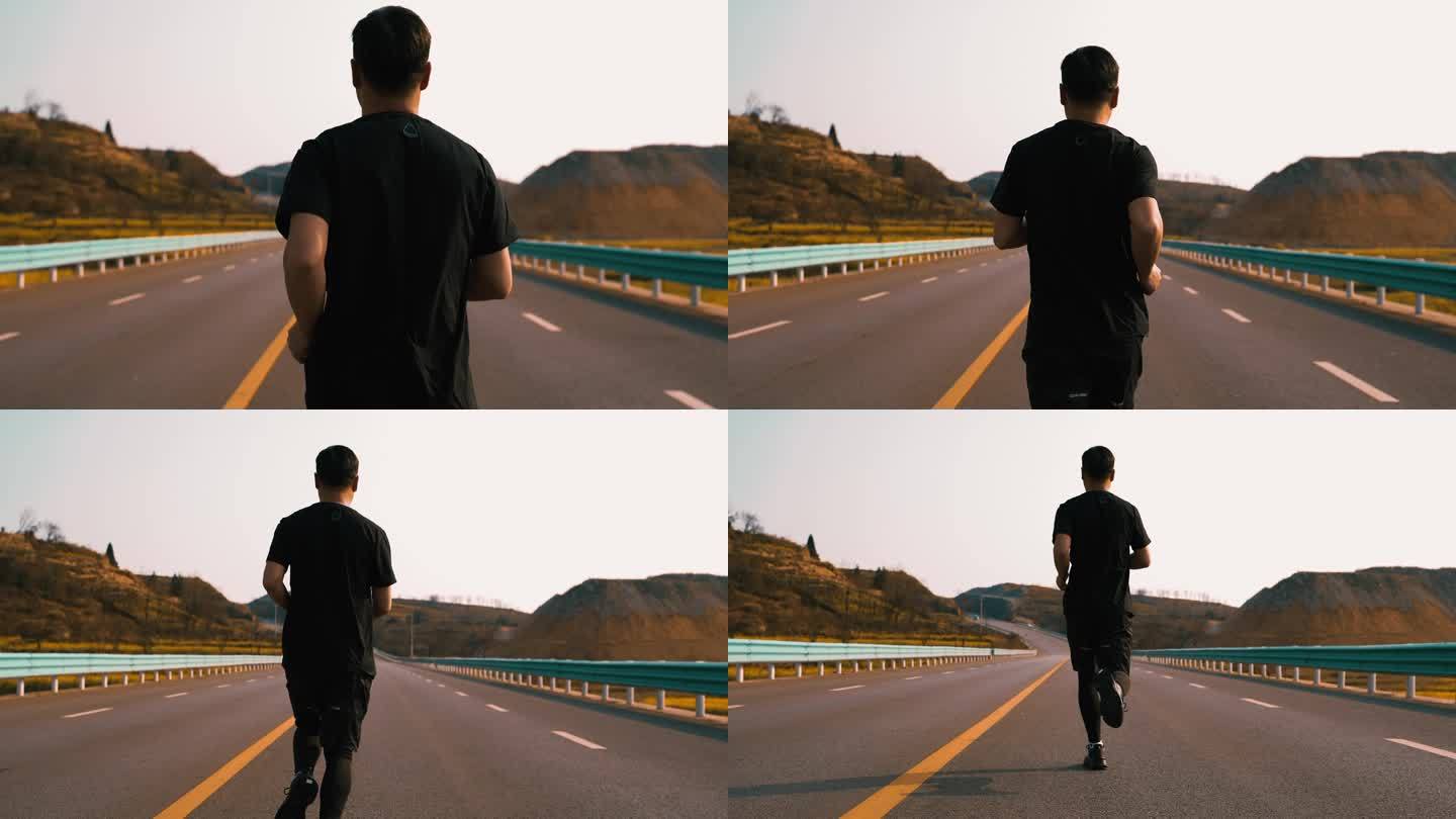 男子公路跑步运动健康快速前进户外生活方式