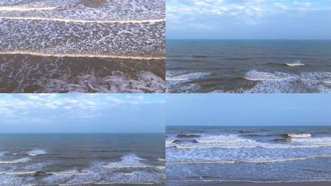 涨潮的海浪打在沙滩上