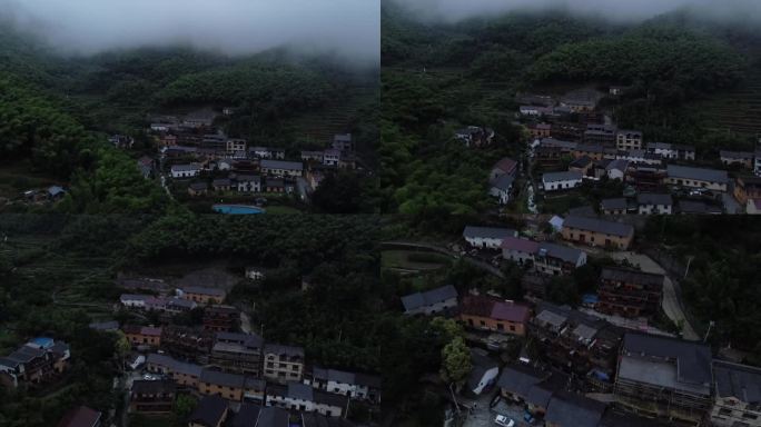 航拍雨天被云雾和竹林环绕的山间农村