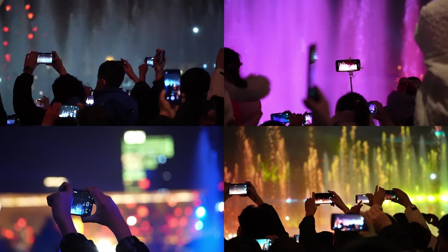民众观赏喷泉 各种手机拍摄场景