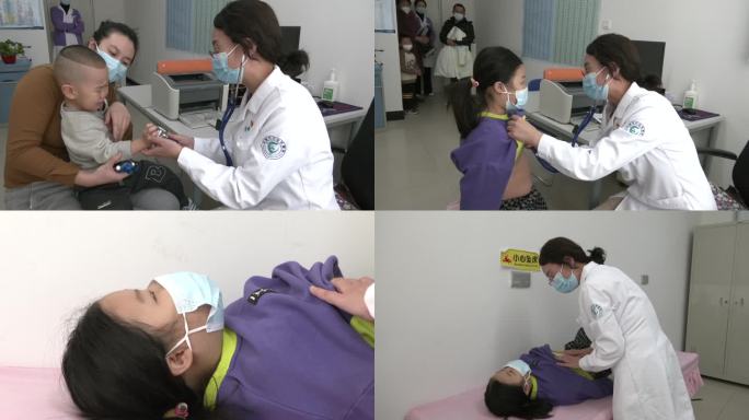 医院儿科诊室医生用听诊器给儿童看病