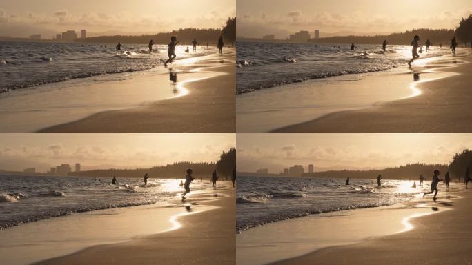 美丽海南三亚海棠湾日落风景小孩沙滩玩耍