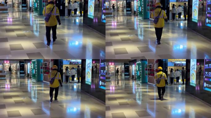 4K美团外卖小哥高档商场里急匆匆赶路背影