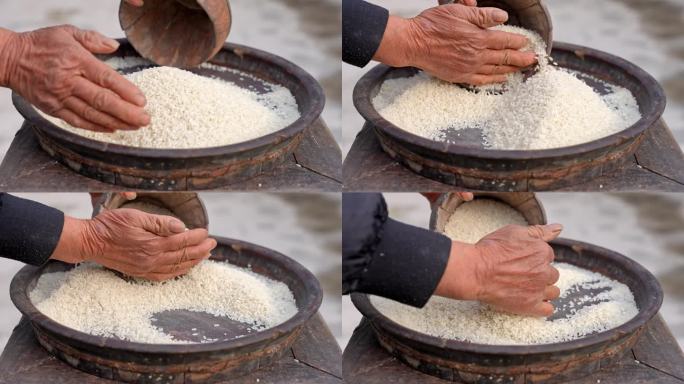 老人手捧大米 大米 老物件米斗