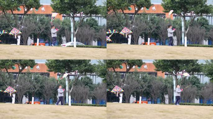 小男孩在城市公园草地上奔跑着放风筝