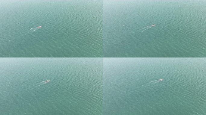 碧绿海水海面上一只行驶的渔船海上风景风光