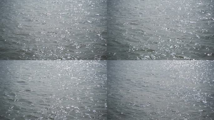 移动的水面波光粼粼湖面阳光照射海水江河面