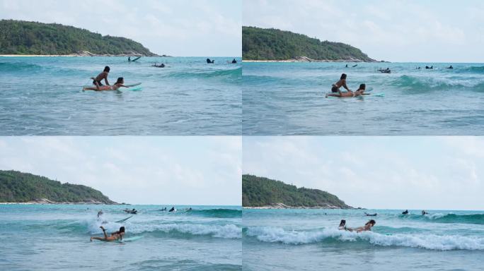 万宁日月湾海滩情侣冲浪慢镜头运动风景