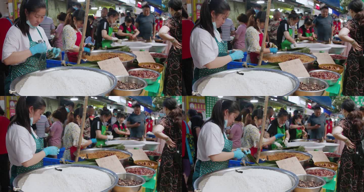 成都马鞍街店员女人忙碌包粽子准备端午节