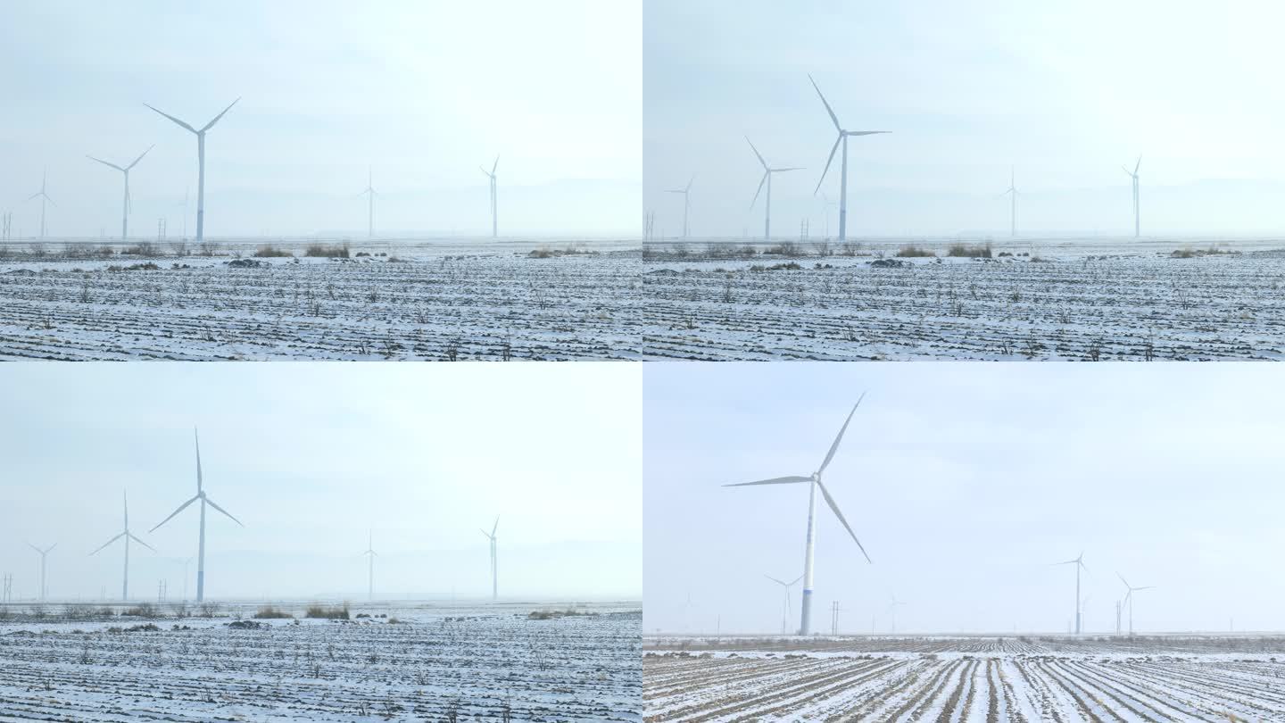 平原冬季雪地的风车发电机