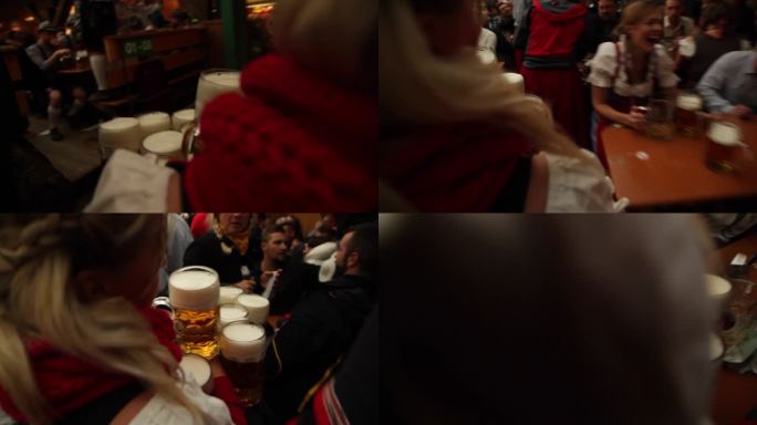 德国慕尼黑啤酒节 服务员端很多扎啤上酒