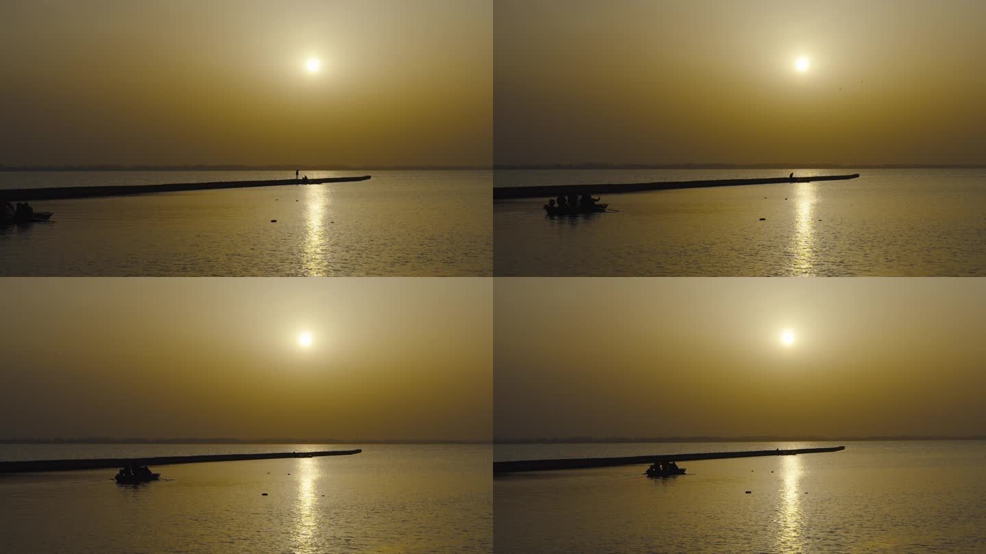 渔船渔民海边水面夕阳宁静浪漫人影