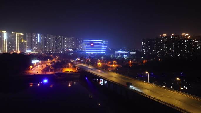 宁乡市金洲大桥创业大楼夜景车流航拍4K