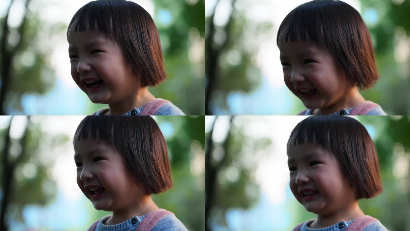 可爱小女孩公园里开心微笑特写镜头