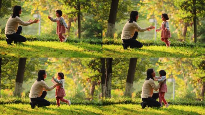 秋天公园小女孩拿树叶跑向妈妈亲子陪伴成长
