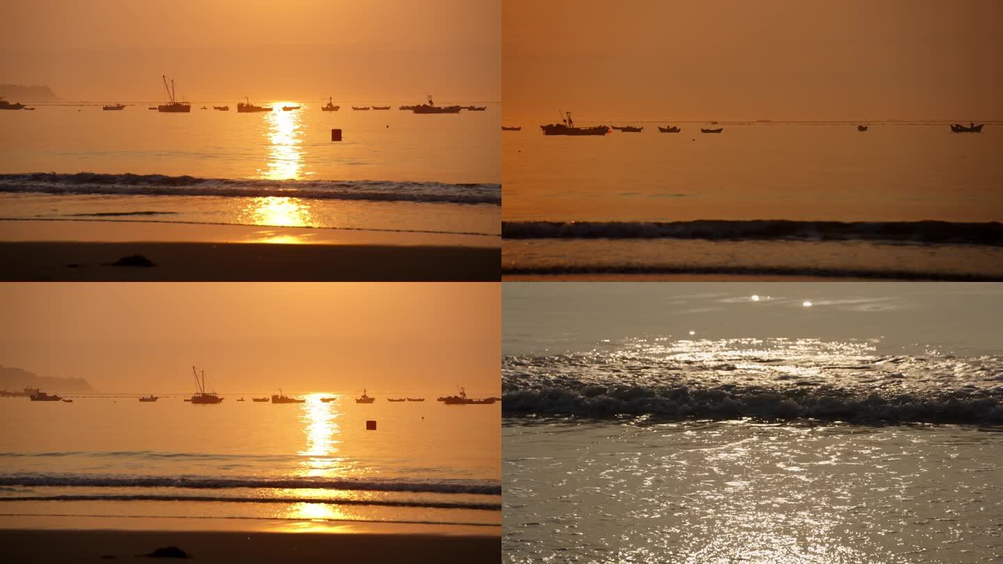 海边日出太阳光倒影渔船海浪