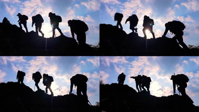 一群人登山剪影团队登山爬山攀岩背包客行者
