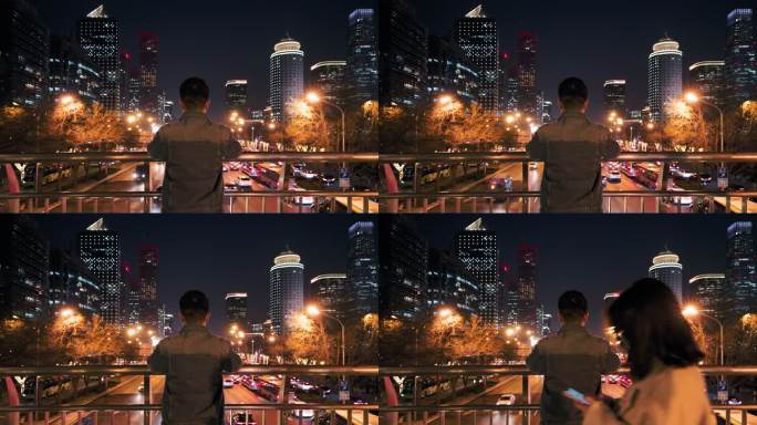 4K年轻男性在天桥看城市夜晚车水马龙背影