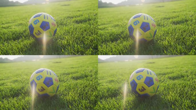 小孩踢足球落地足球广告草地足球美好童年