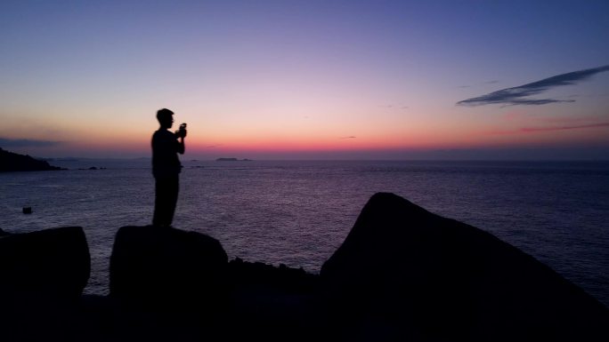 海边黄昏 海边人剪影 海边礁石