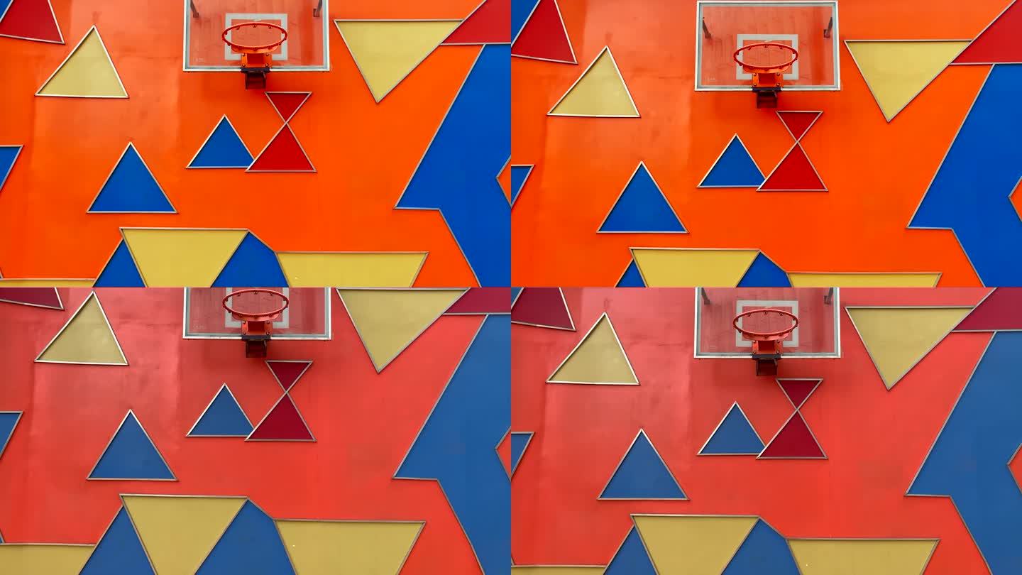 彩色三角板背景上的篮球框