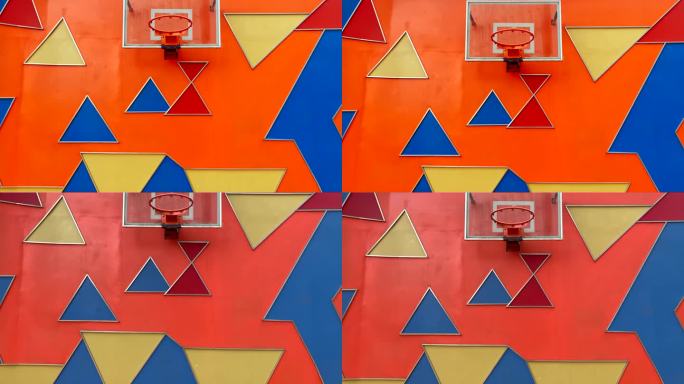 彩色三角板背景上的篮球框