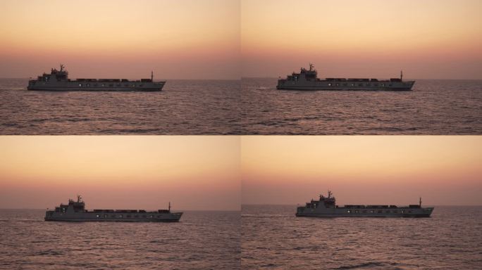 轮船行驶在夕阳下的海平面