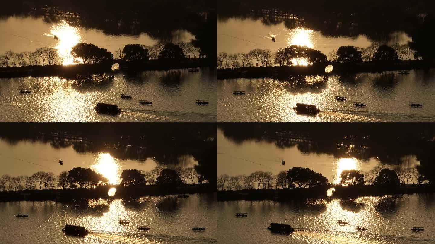 4k长焦夕阳下的西湖苏堤波光粼粼航拍