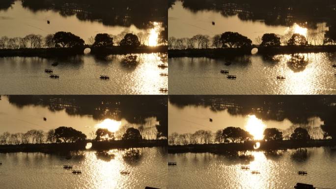 4k长焦夕阳下的西湖苏堤波光粼粼航拍