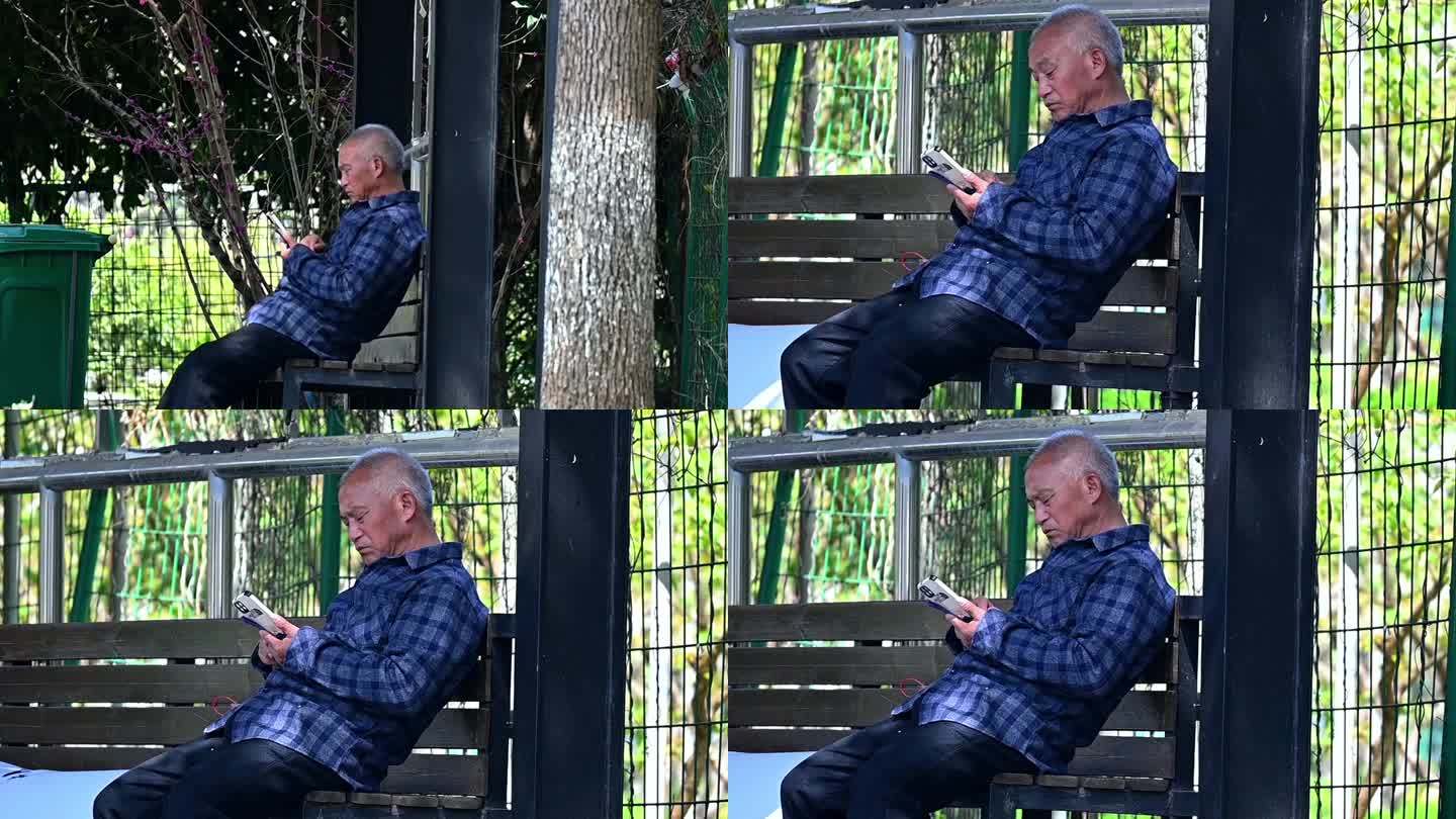 孤独老人公园里看着手机-老年人用智能手机